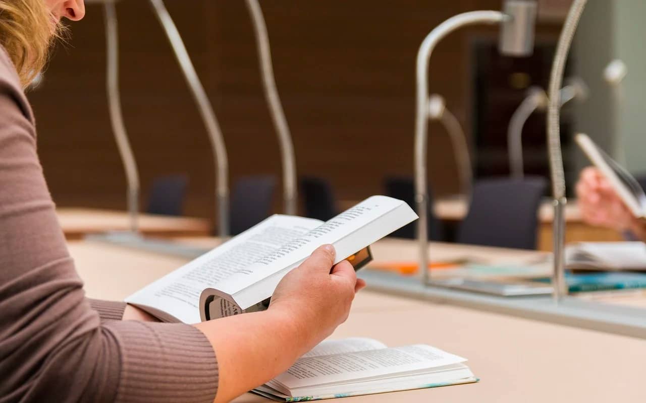 a man reading in a library