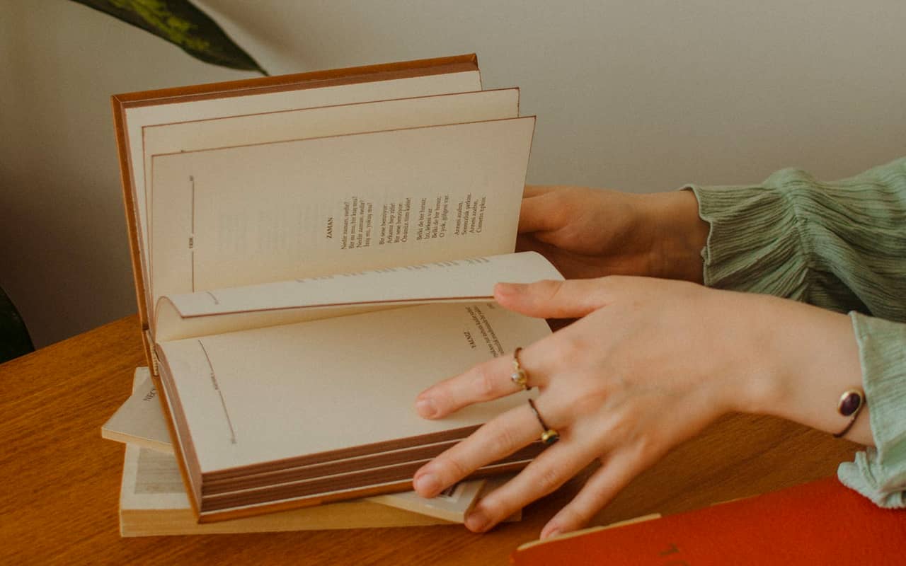 a woman is trying to find a page