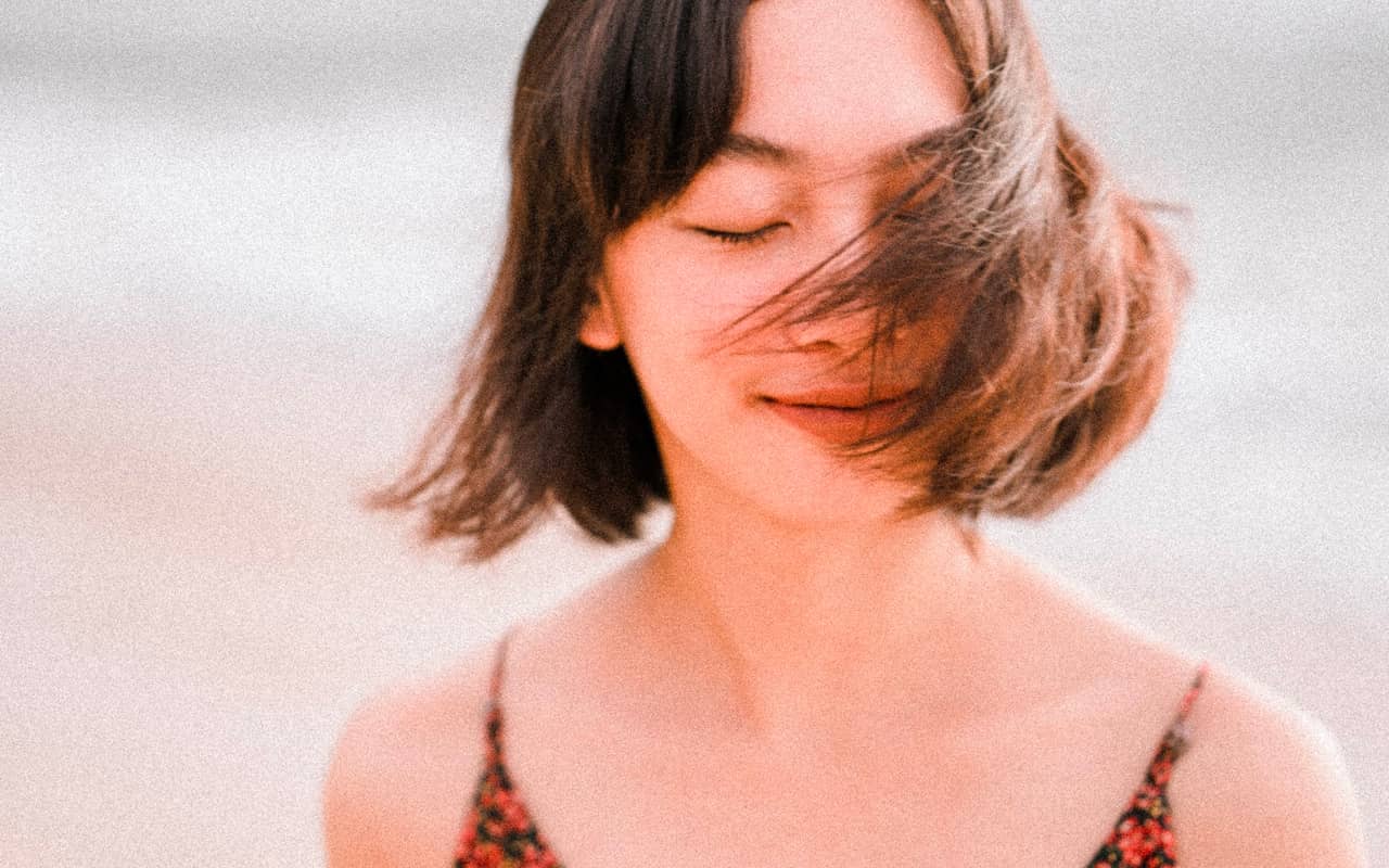 a women is thinking with her eyes closed