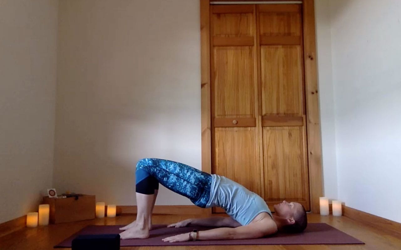 The post author demonstrates Setu Bandha Sarvangasana (Bridge).
