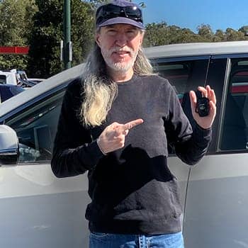 Deskilling feature image of Anthony Metivier with car keys after relearning how to drive after ten years