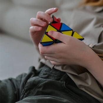 highest iq feature image of a woman holding a puzzle cube