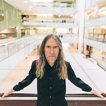 how to keep your memory sharp as you age feature image of Anthony Metivier in State Library of Queensland