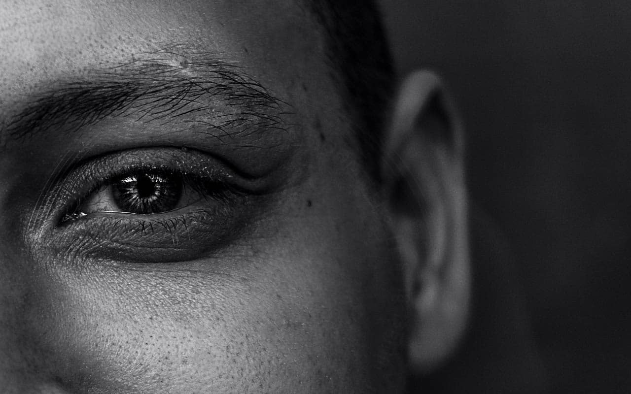 A black and white photo close-up of a partial human face.