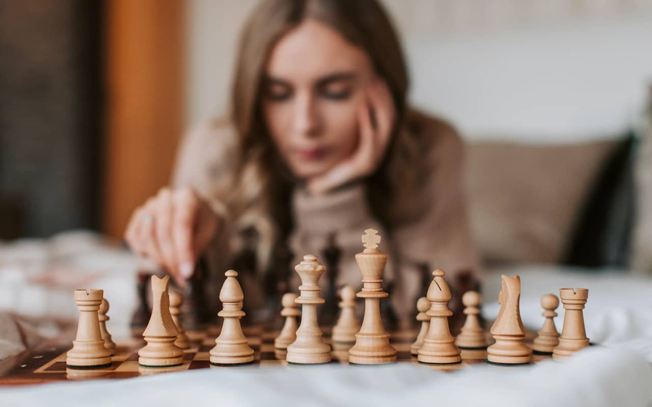 a woman playing chess