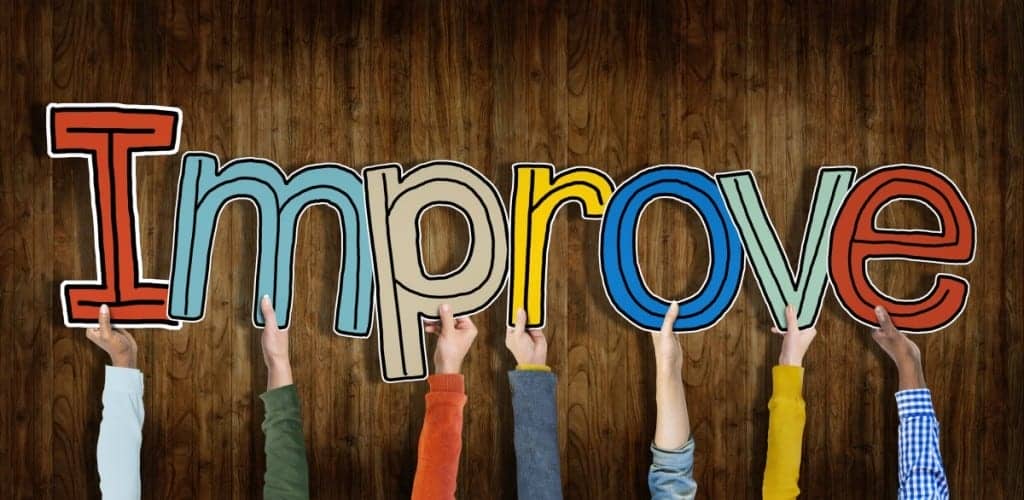 Image of the word "Improve" held up by hands