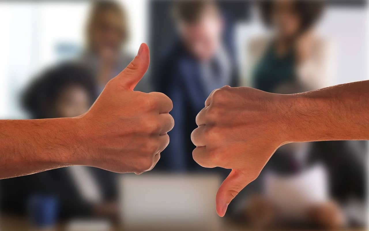 positive and negative expressed by thumbs up and thumbs down