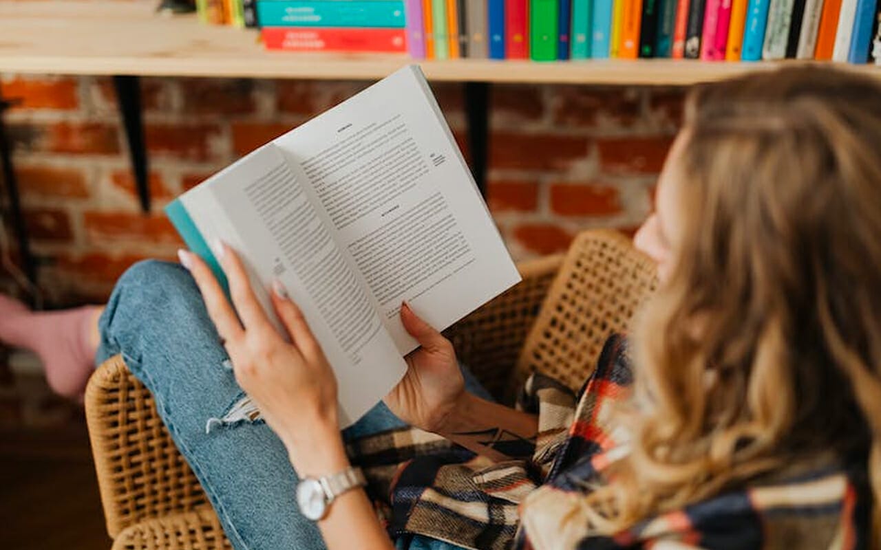 reading a book on chairs
