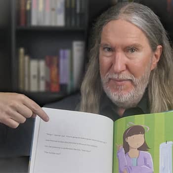 Anthony Metivier with a story book to illustrate a principle related to the mnemonic Story Method