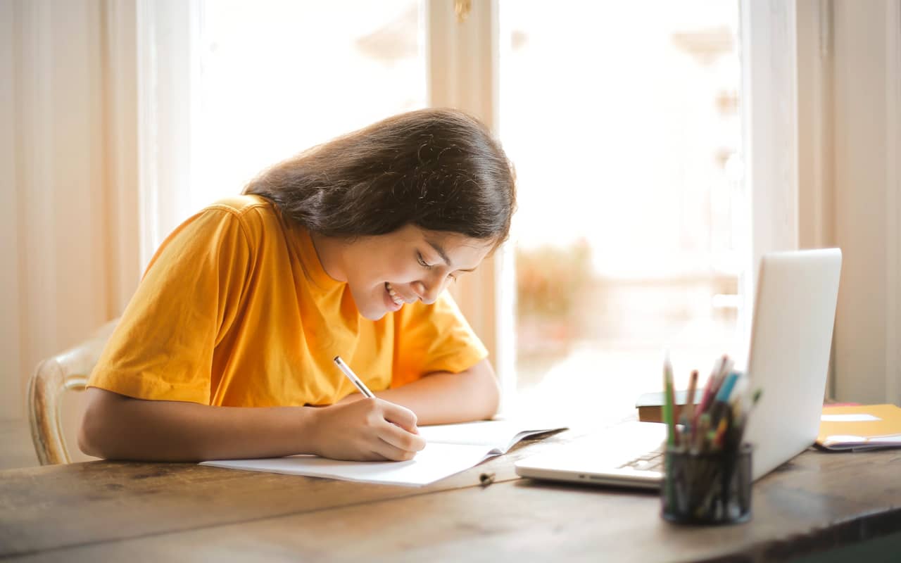 yellow shirt girl learning happily